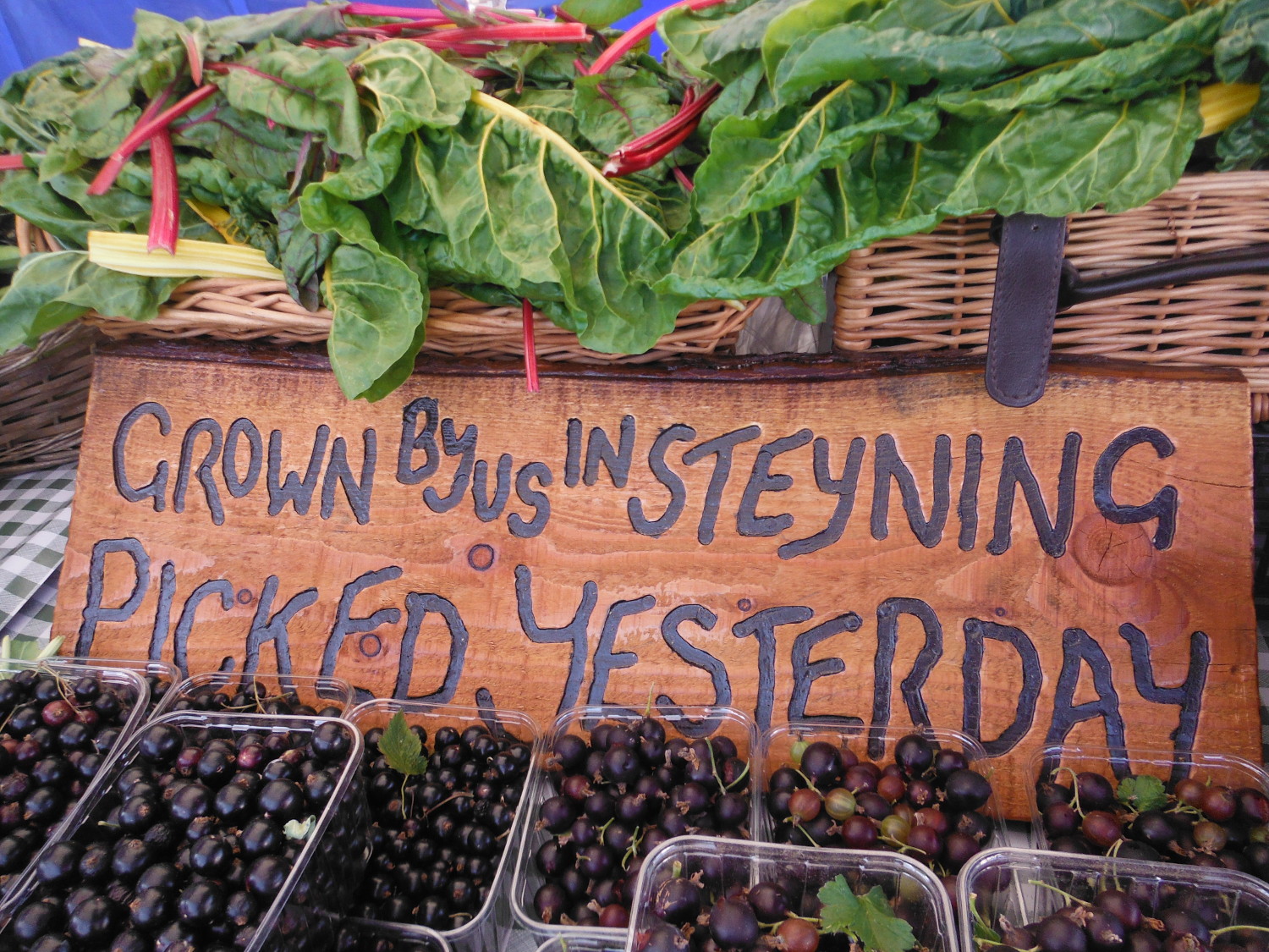 Farm sign with fruit and veg